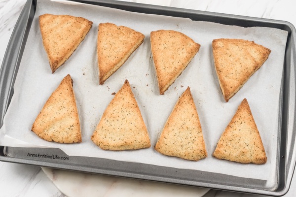 Lemon Poppy Seed Scones Recipe with Glaze. This lemon poppy seed scones recipe features a delicious lemon glaze. The result is moist scones bursting with poppy seeds and freshly grated lemon zest. This lemon-flavored scones recipe goes well with afternoon tea or morning coffee.