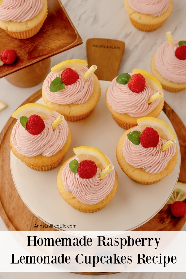 overhead view of 5 homemade raspberry lemonade cupcake on a white plate, there are other raspberry lemonade cupcakes scattered around the platter