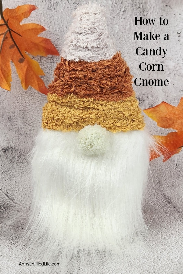 close-up of a candy corn gnome set against a light grey background