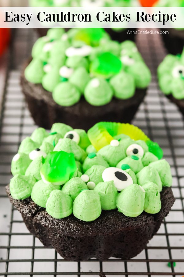 Two cauldron cakes on a wire rack.