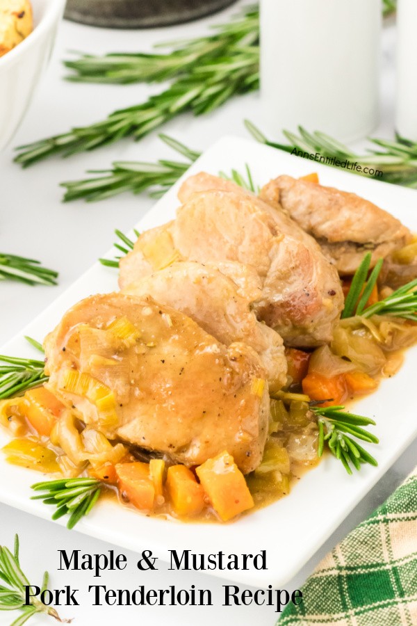 On top of a white serving platter is an array of cooked vegetables. On top of those vegetables sits maple mustard pork.