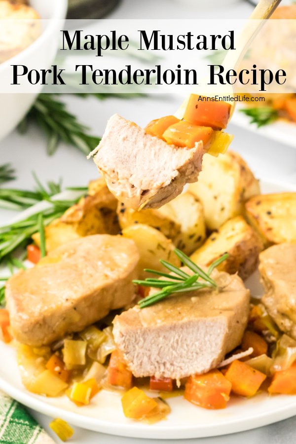A fork filled with maple mustard pork and potatoes being lifted from the plate below.