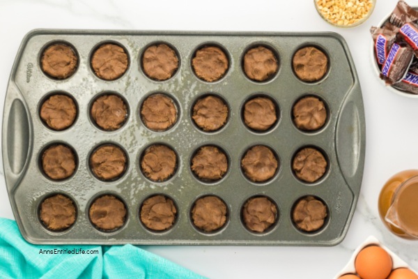 Easy Snickers Stuffed Cookie Cups Recipe. Discover how to make easy Snickers stuffed cookie cups. This simple recipe creates delicious cookie cups filled with your favorite candy bar for a perfect sweet treat.