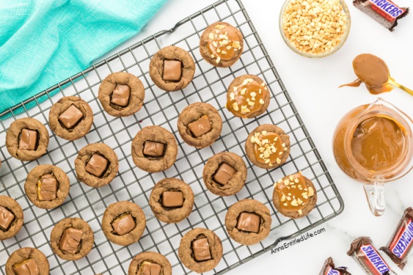 Easy Snickers Stuffed Cookie Cups Recipe. Discover how to make easy Snickers stuffed cookie cups. This simple recipe creates delicious cookie cups filled with your favorite candy bar for a perfect sweet treat.