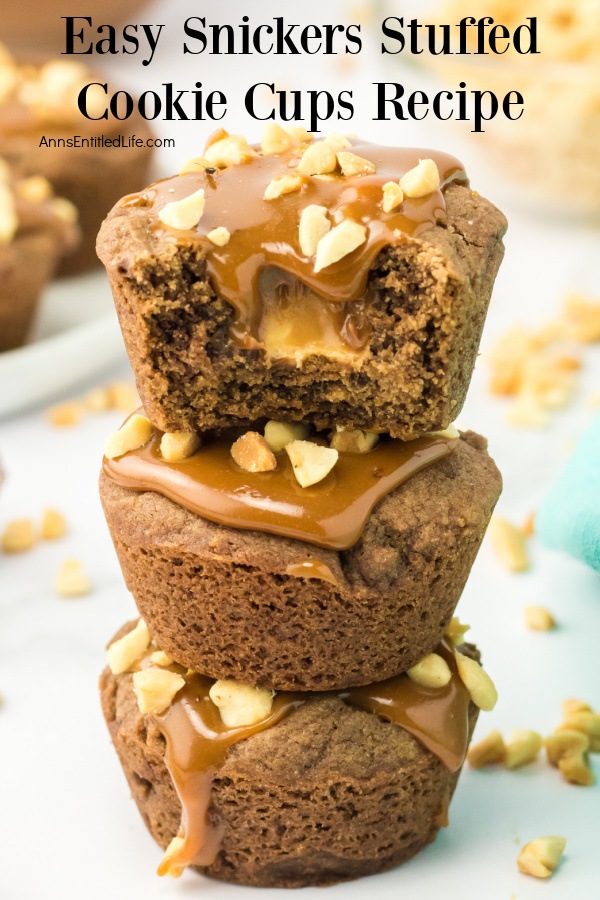 A stack of three snickers stuffed cookie cups on a white board