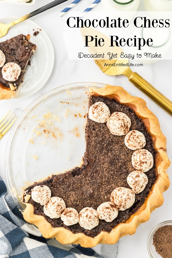 overhead view of a chocolate chess pie, two pieces are removed, one is on a white plate in the upper left.