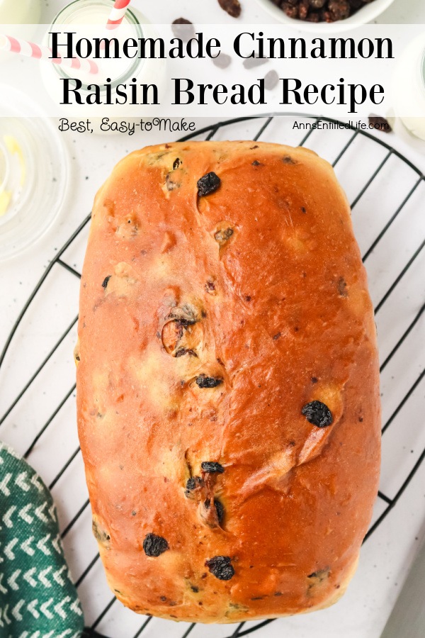 On overhead view of a whole loaf of cinnamon raisin bread on a wire rack.