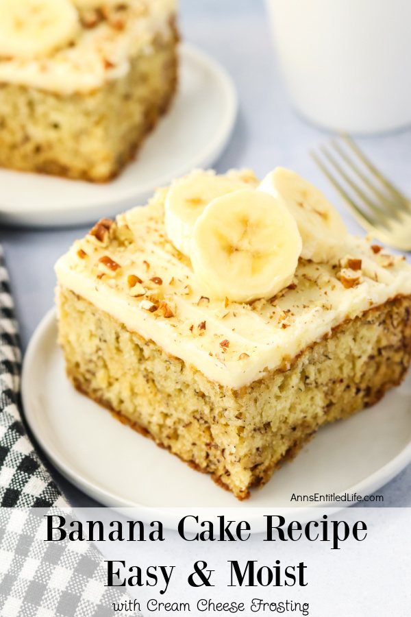 A piece of banana cake on a white plate, a second piece can be seen in the upper left