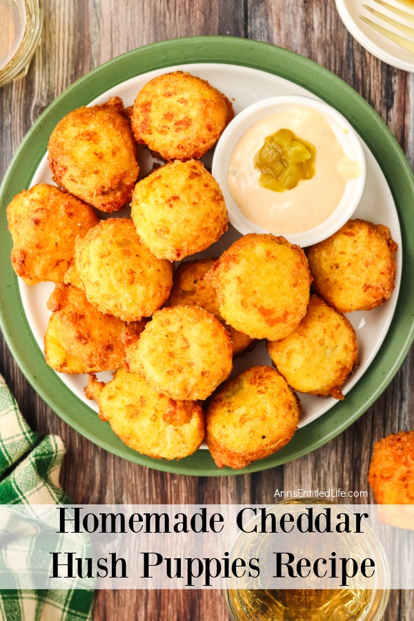 overhead view of Cheddar hush puppies and a white bowl filled with chili aioli in a white and green bowl