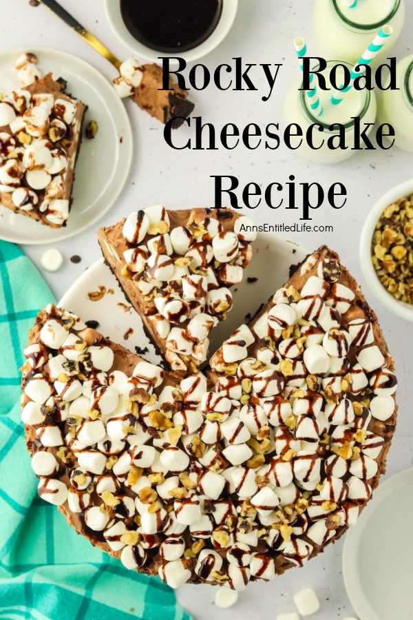 Overhead view of a cut no-bake rocky road cheesecake with a piece missing