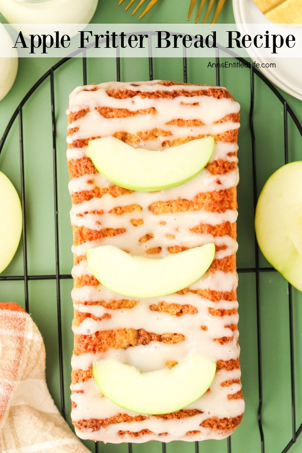 An overhead view of a whole apple fritter bread on a wire rack