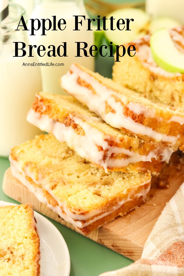 A profile view of a cut apple fritter bread on a wooden cutting board