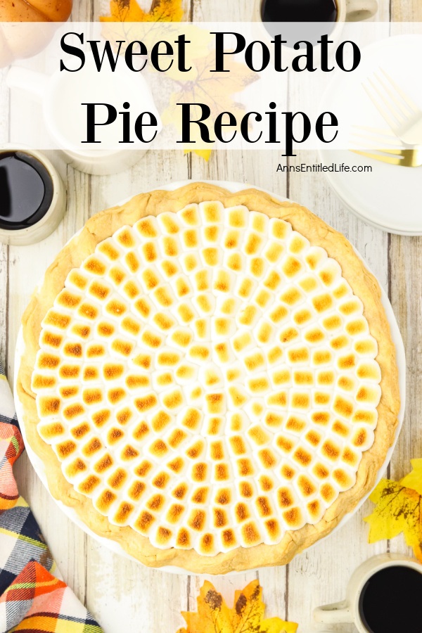 An overhead view of a whole sweet potato pie with mini marshmallow topping