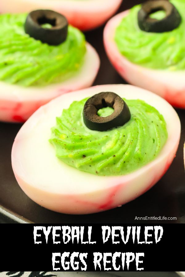 Eyeball Deviled Eggs Recipe for Creepy Halloween Snacks Upclose view of a deviled egg made to look like red veined eyeballs.