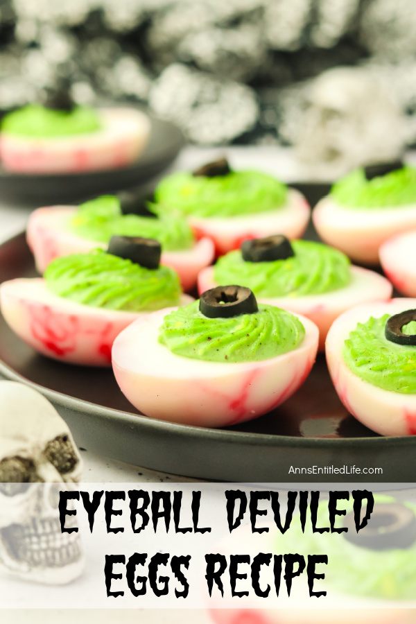 Eyeball Deviled Eggs Recipe for Creepy Halloween Snacks Upclose side view of a plate of deviled eggs made to look like red veined eyeballs.