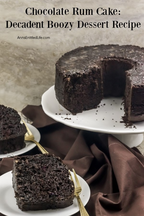 A chocolate rum cake on a white plate in the upper right. There are two slices of cake on white plates in the lower left