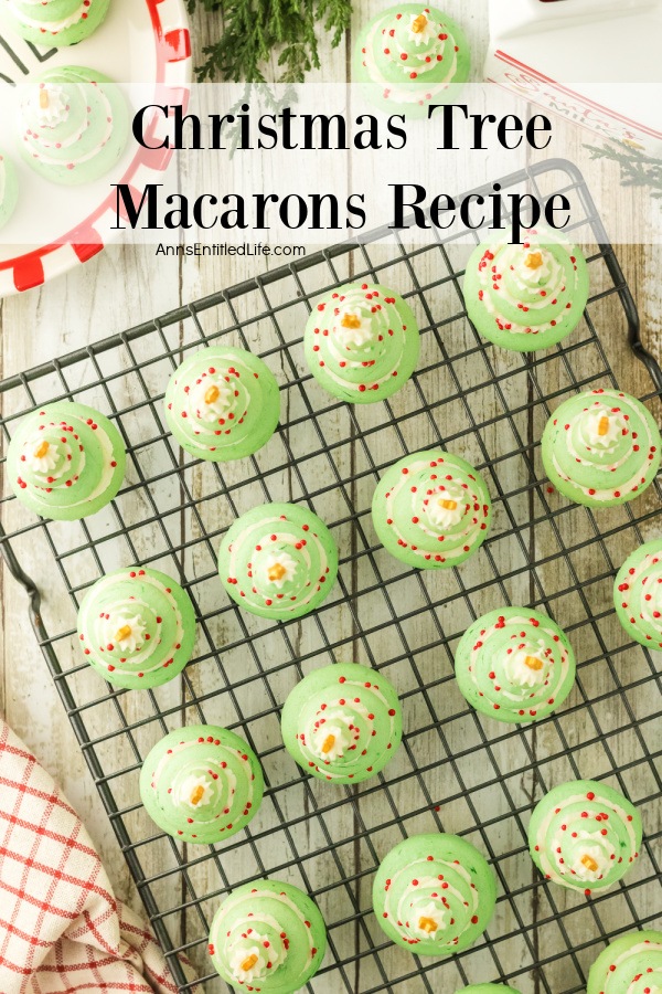 Christmas Tree Macarons Recipe – Festive Holiday Treats Overhead image of 15 Christmas tree macarons on a wire rack. There are several more macarons above and to the left on a Christmas paper plate