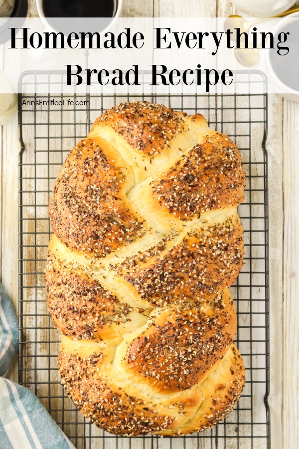 Overhead view of a loaf of homemade everything bread on a wire rack