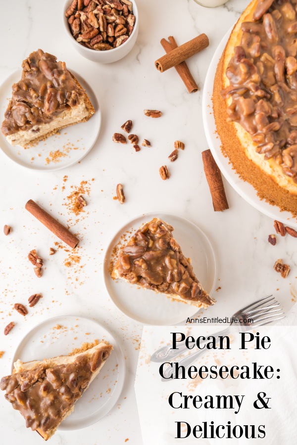 Pecan Pie Cheesecake Recipe: Creamy and Delicious Three pieces of pecan pie cheesecake on white plates are arranged on the center and left side of a white table. The rest of the cheesecake is partially shown in the upper right. There are pecans and cinnamon sticks interdispursed between the cheesecake on the table.