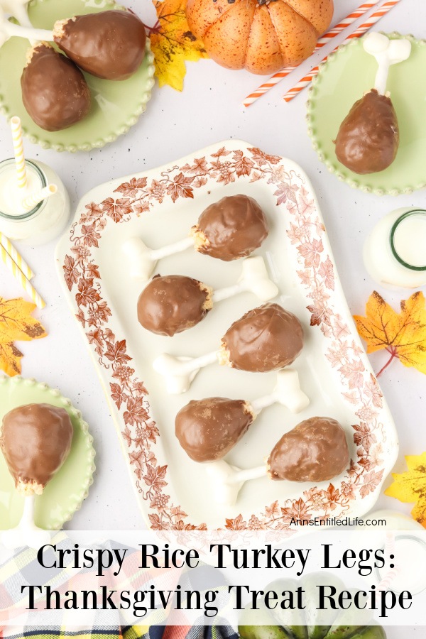 Six rice crispy cereal turkey legs on a platter trimmed with leaves. There are three green plates with more rice crispy cereal turkey legs surrounding it. There is a jug of milk with a straw in the upper right.