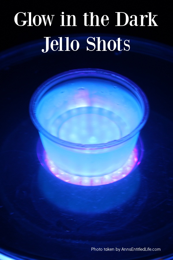 Glow in the Dark Jello Shots Recipe | Easy Party Idea overhead view of a glowing blue jello shot against a dark background