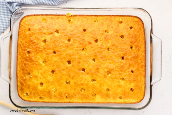 Boston Cream Pie Poke Cake Recipe - Easy & Delicious. Turn a simple cake mix into this irresistible Boston cream pie poke cake. Holes filled with creamy vanilla pudding, finished with smooth chocolate topping. Quick, make-ahead dessert everyone loves.
