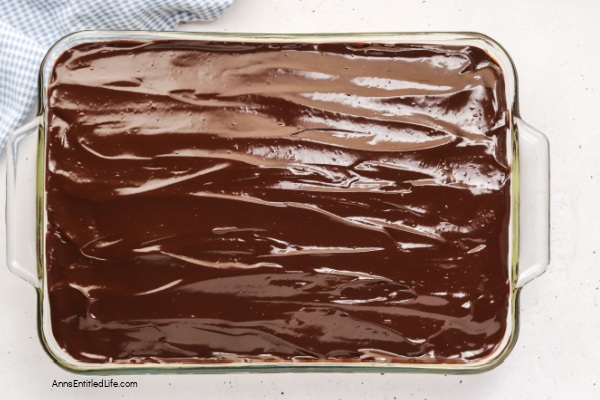 Boston Cream Pie Poke Cake Recipe - Easy & Delicious. Turn a simple cake mix into this irresistible Boston cream pie poke cake. Holes filled with creamy vanilla pudding, finished with smooth chocolate topping. Quick, make-ahead dessert everyone loves.