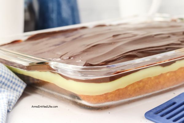 Boston Cream Pie Poke Cake Recipe - Easy & Delicious. Turn a simple cake mix into this irresistible Boston cream pie poke cake. Holes filled with creamy vanilla pudding, finished with smooth chocolate topping. Quick, make-ahead dessert everyone loves.