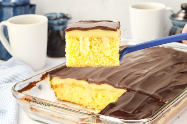Boston Cream Pie Poke Cake Recipe - Easy & Delicious. Turn a simple cake mix into this irresistible Boston cream pie poke cake. Holes filled with creamy vanilla pudding, finished with smooth chocolate topping. Quick, make-ahead dessert everyone loves.
