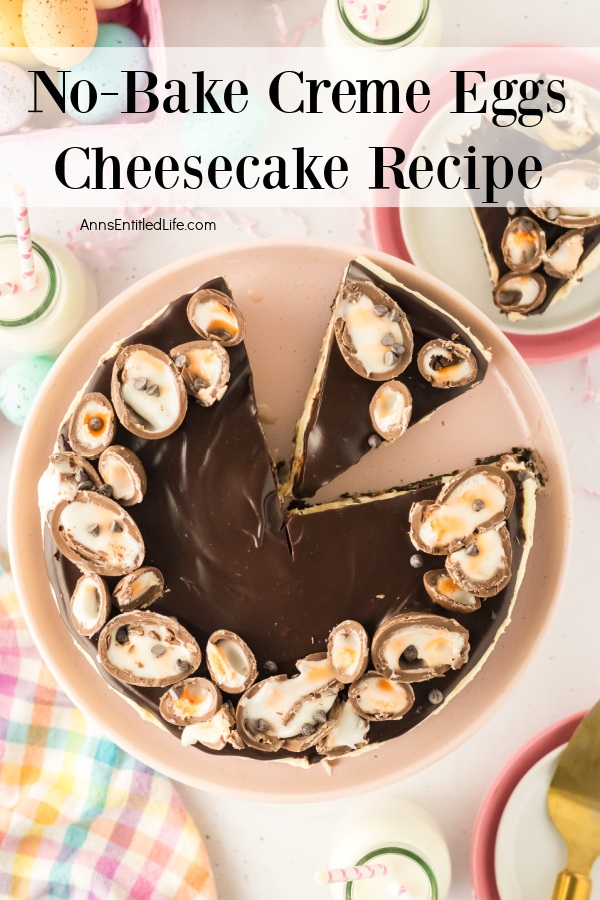 No-Bake Creme Eggs Cheesecake Recipe An overhead image of a creme egg cheesecake with two pieces cut, one removed to the plate in the upper right