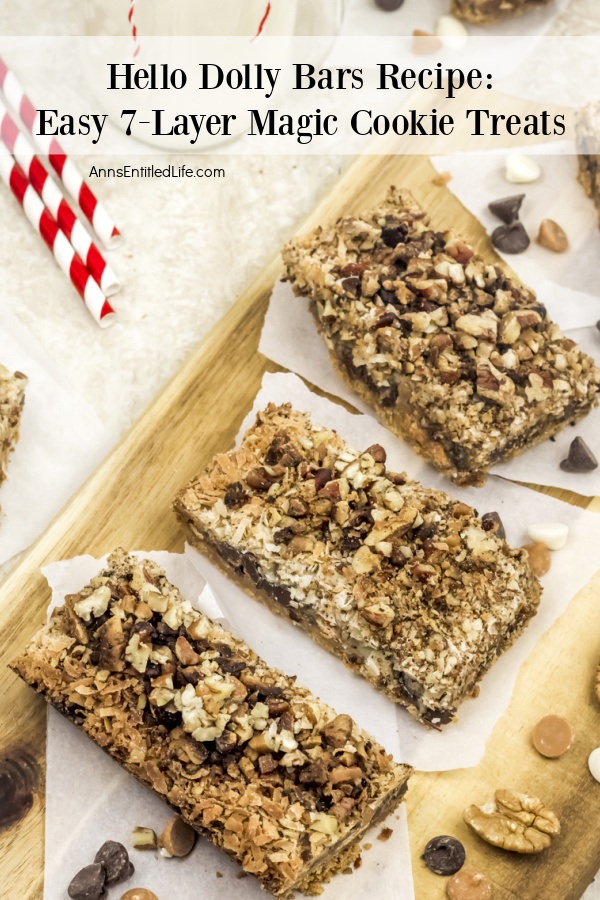 hello Dolly cookie bars on white papers on top of butcher block cutting board
