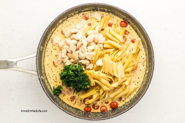 Creamy Tuscan Chicken Pasta Recipe - Easy 30-Minute Dinner. Creamy Tuscan chicken pasta with tender chicken, cherry tomatoes, spinach, garlic, and Parmesan in a rich sauce. Quick one-pan Italian-inspired meal ready in 30 minutes for weeknight dinners.