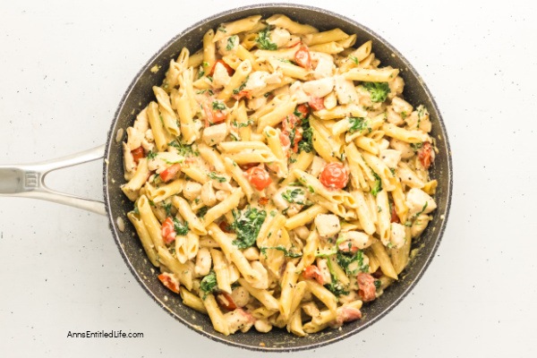Creamy Tuscan Chicken Pasta Recipe - Easy 30-Minute Dinner. Creamy Tuscan chicken pasta with tender chicken, cherry tomatoes, spinach, garlic, and Parmesan in a rich sauce. Quick one-pan Italian-inspired meal ready in 30 minutes for weeknight dinners.