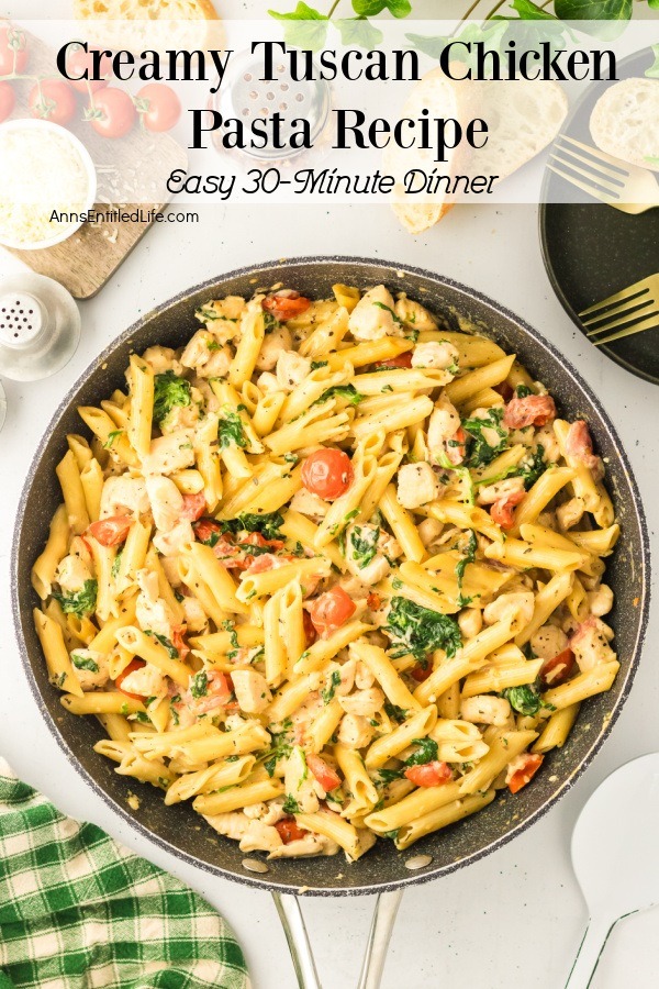 A skillet filled with Tuscan chicken pasta. Plates, forks, and tomatoes partially surround the image