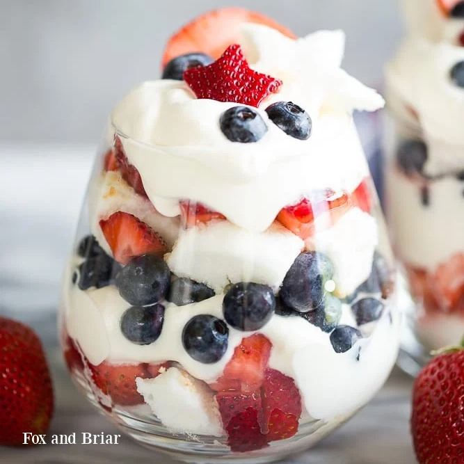 Make these stunning individual Easy Red, White, and Blue Trifles with layers of angel food cake, creamy filling, and fresh berries. A light, refreshing dessert everyone loves for your 4th of July celebration.