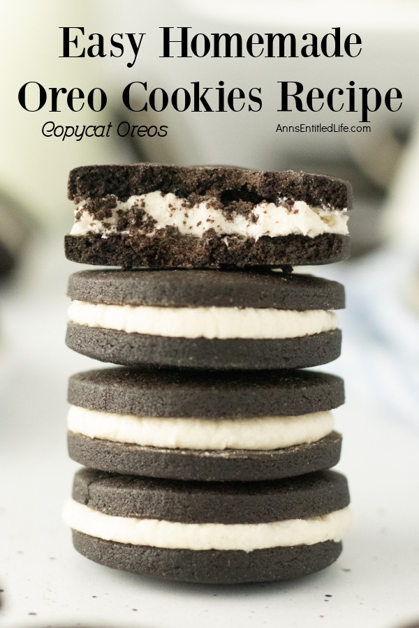OA stack of 4 homemade Oreo cookies, the top cookie is broken in half to show the inside of the cookie.