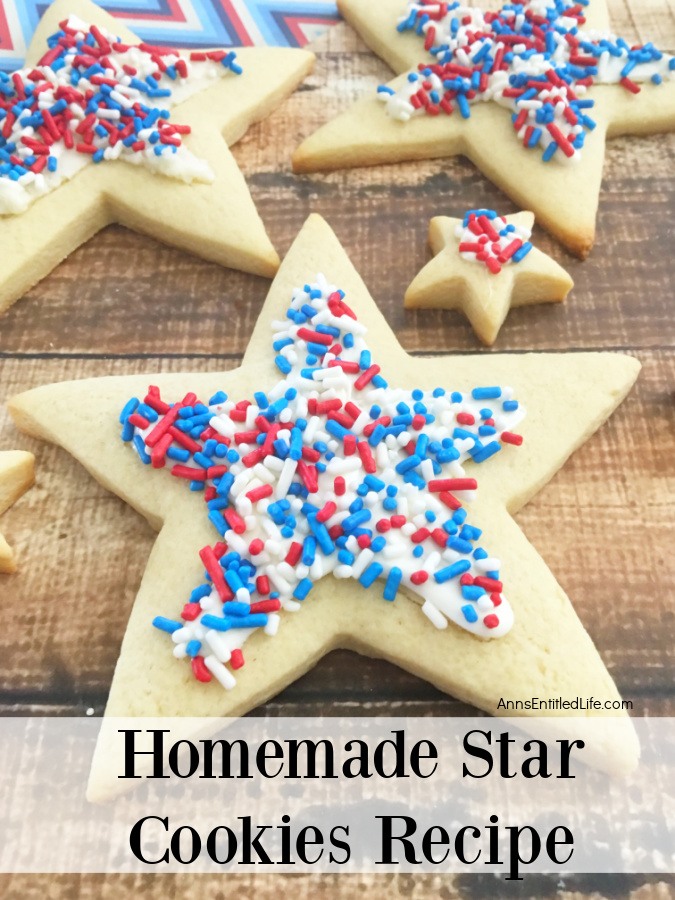 Various sized star shaped cookies decorated in red, white, and blue on a brown board
