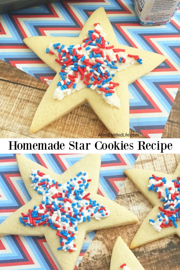 Various sized star shaped cookies decorated in red, white, and blue on a brown board covered with a red, white, and blue paper.