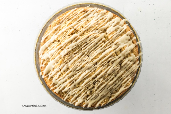 Irish Apple Cake Recipe | Easy, Moist, Spiced Apple Cake with Whiskey Glaze. Discover this Irish Apple Cake recipe; a moist, tender farmhouse classic packed with tart apples, warm spices, crunchy struesel topping completed with a whiskey glaze. Perfect for tea time or any cozy gathering.
